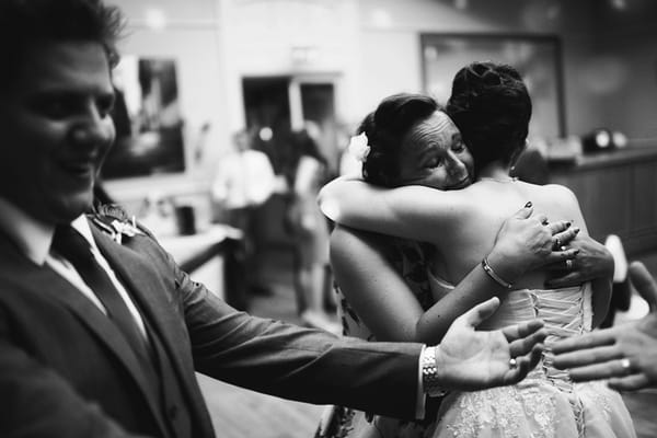 Bride hugging lady - Picture by Martin Makowski Photography