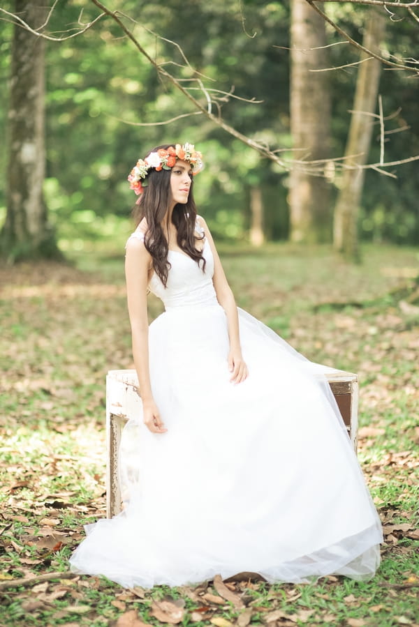 Vintage bride with floral headband in woods