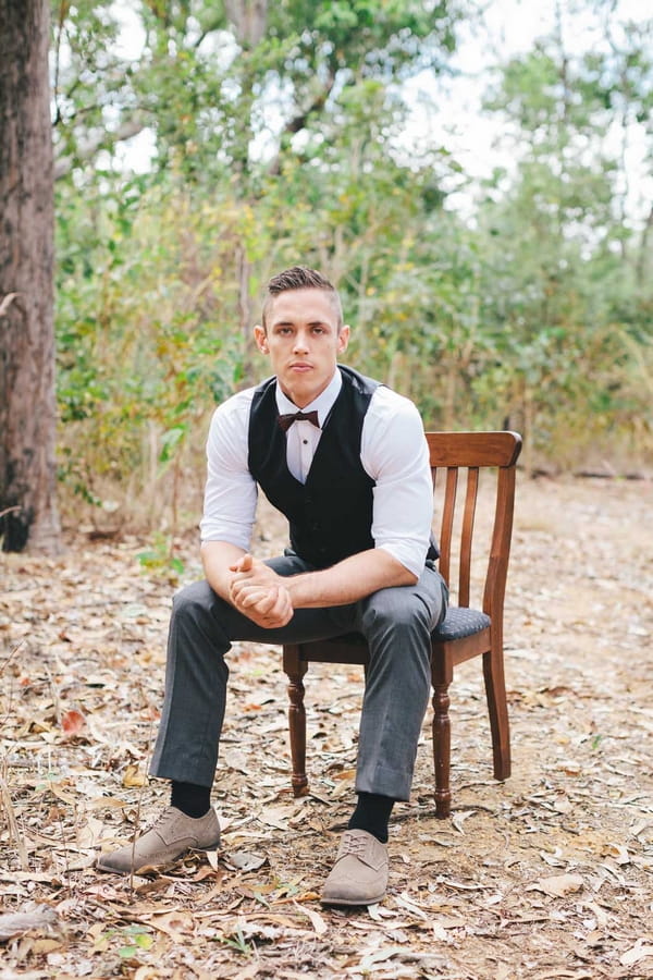 Groom sitting on chair