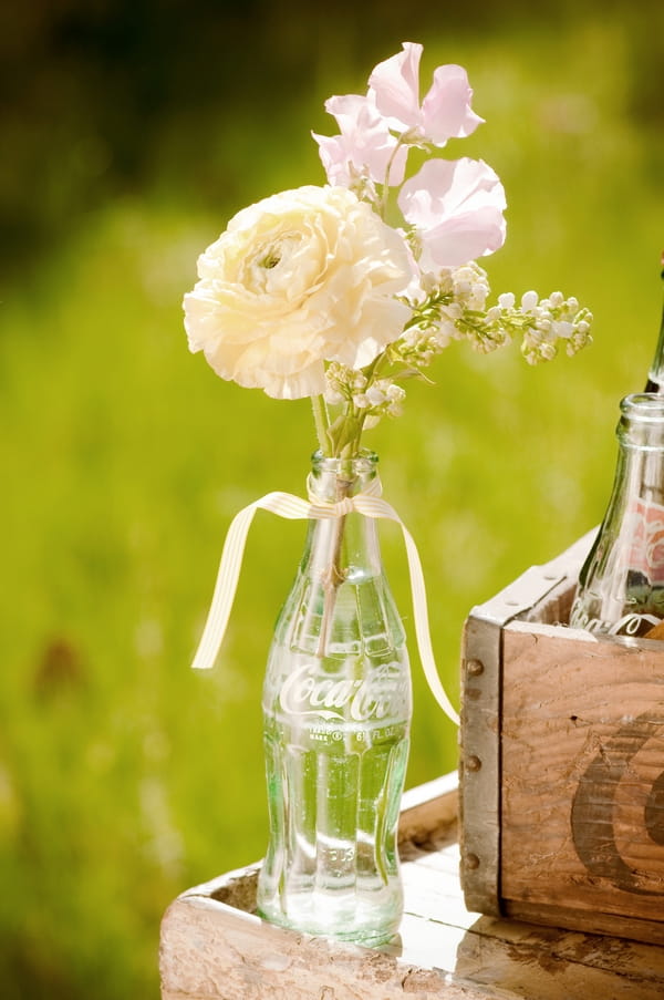 Flowers in Coka Cola bottle