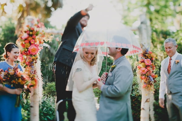 Sweet shower over bride and groom in wedding ceremony