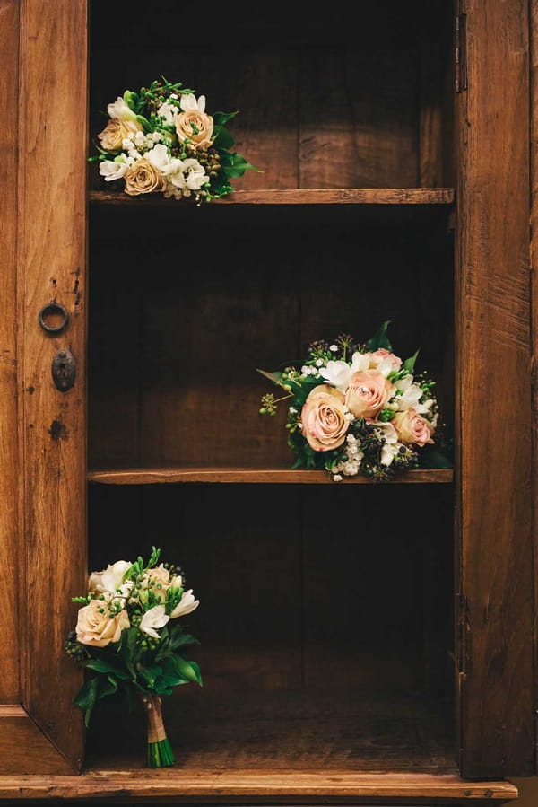 Bouquets on bookcase