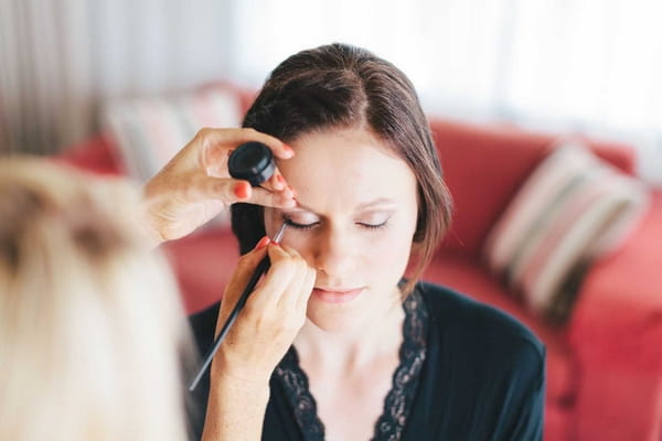 Bride having make-up done