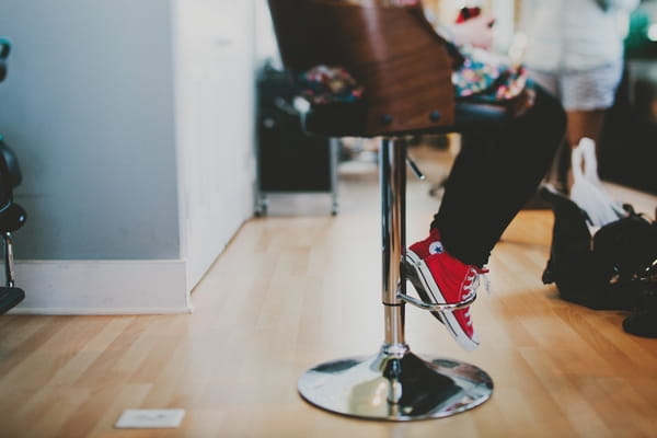 Woman's legs sitting on chair