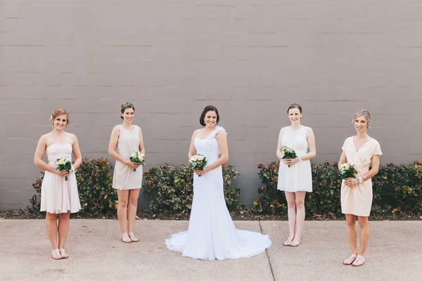 Bride and bridesmaids in a line