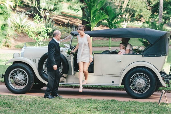 Bridesmaid getting out of car