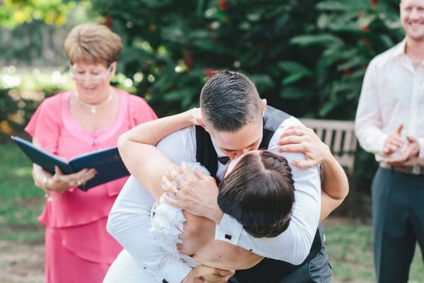 Bride and groom kiss