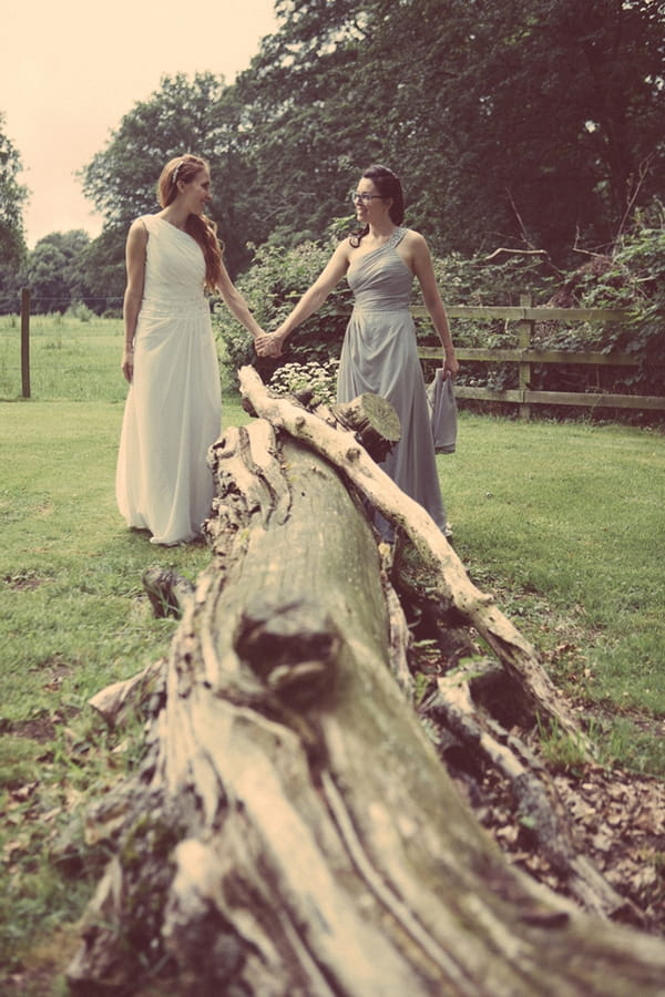 Brides by fallen tree
