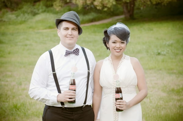 Bride and groom with Coka Cola bottles