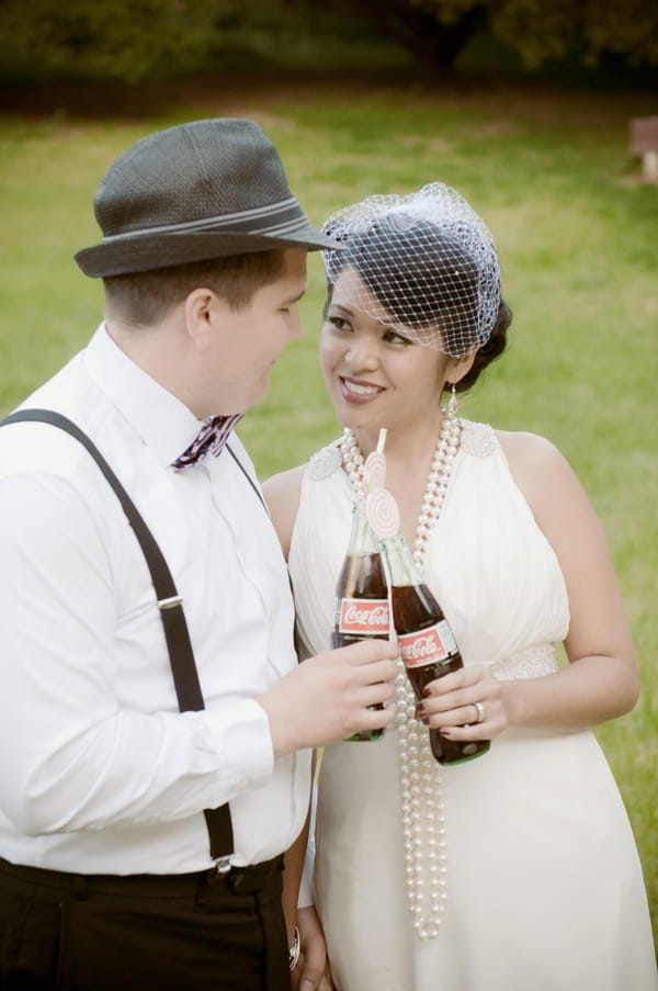 Bride and groom with Coka Cola bottles