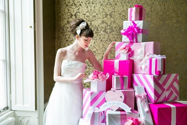 Bride next to pile of pink presents