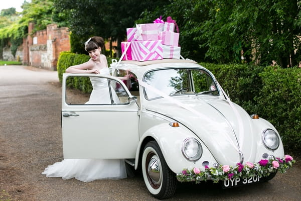 Bride next to VW Beetle