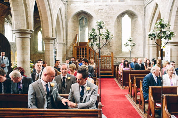 Wedding guests waiting in church