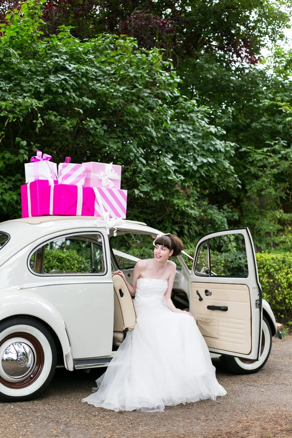 Bride sitting in VW Beetle