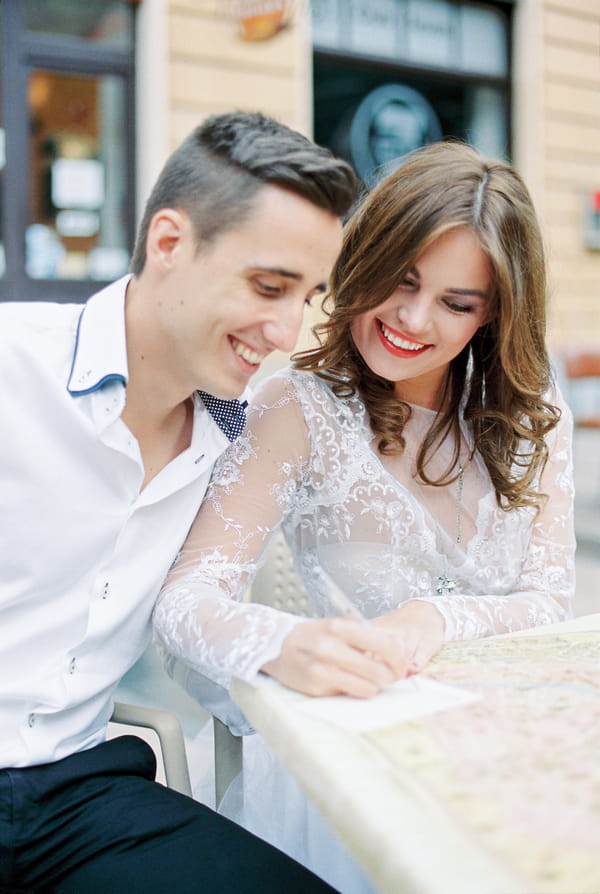 Bride writing postcard