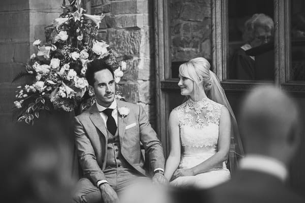 Bride and groom sitting in church