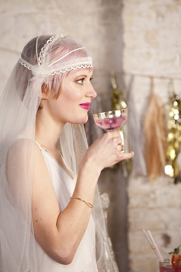 Bride about to take sip of drink