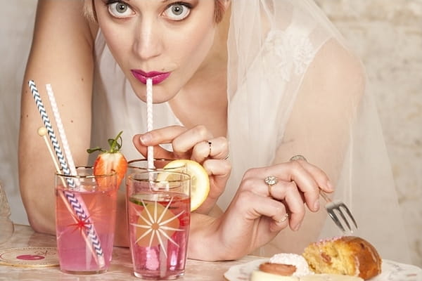 Bride drinking through straw