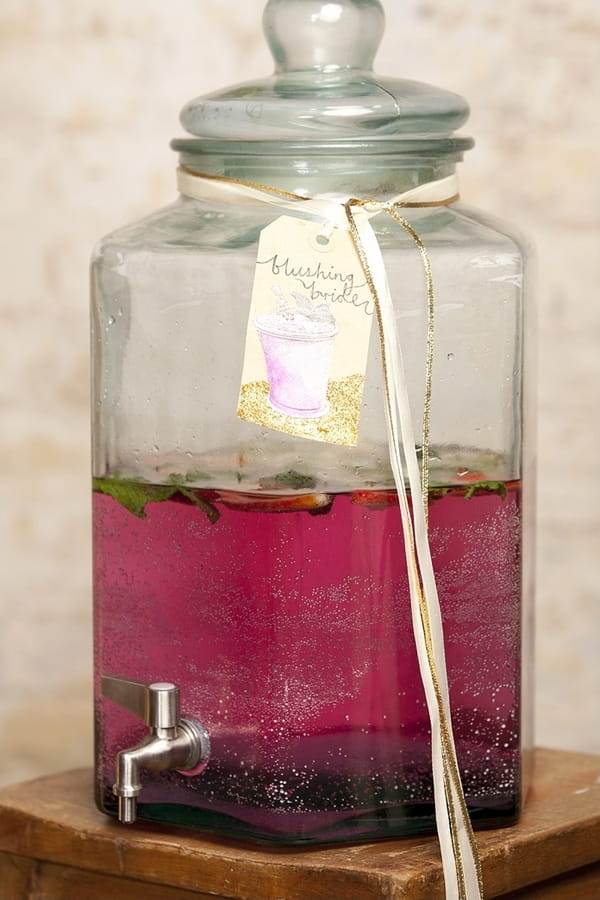 Pink drink in large glass container