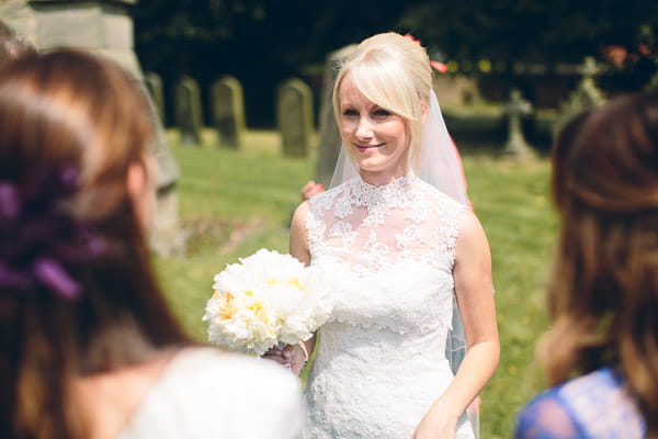 Bride wearing Urdiel wedding dress by Pronovias