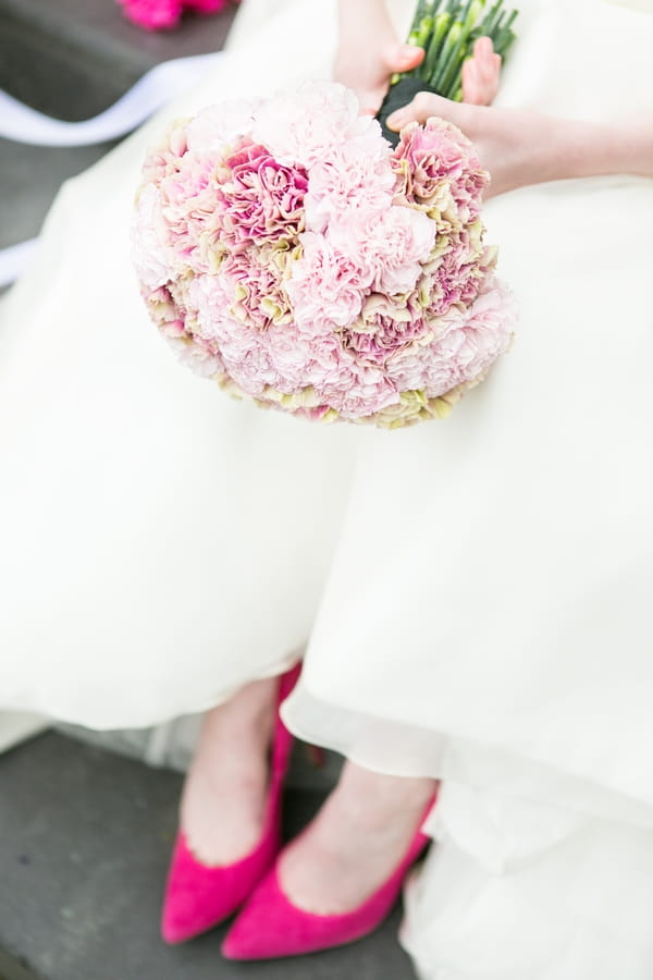 Bouquet and bride's pink shoes