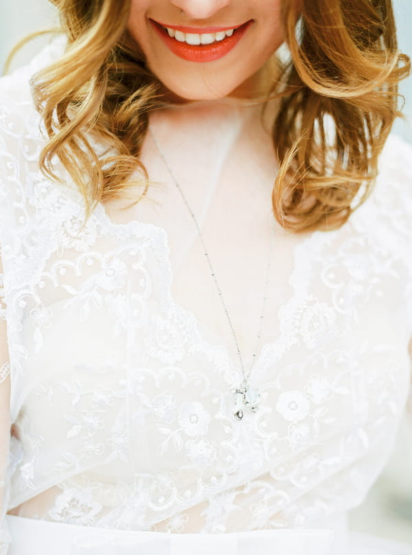 Necklace around bride's neck