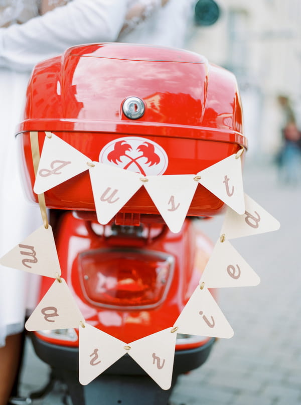 Bunting on back of red Vespa