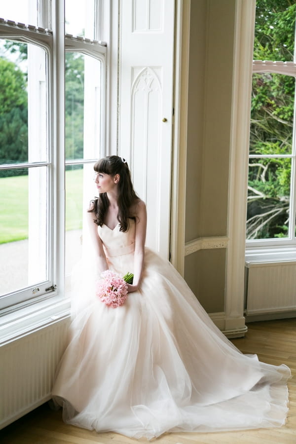 Bride looking out of window