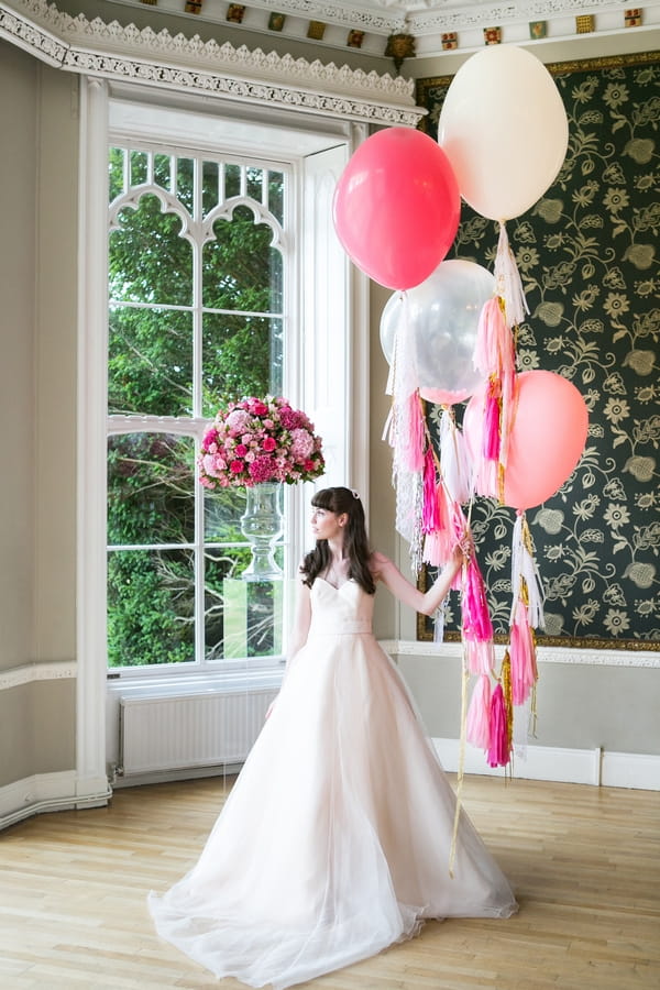 Bride holding balloons