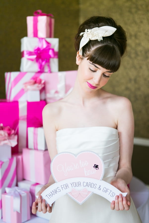 Bride holding heart sign