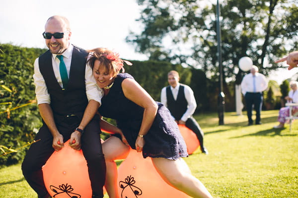 Wedding guests on space hoppers