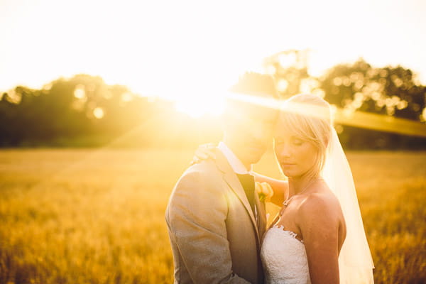 Bride and groom in hazy sunshine