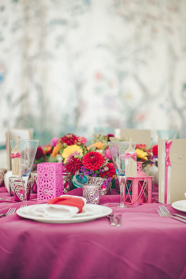 Wedding table dressed with bright accessories