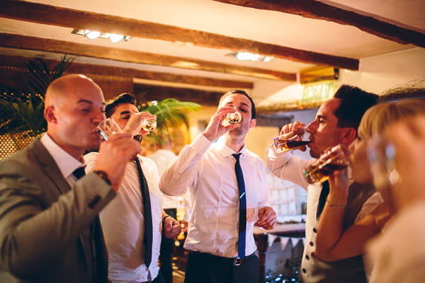 Groomsmen drinking