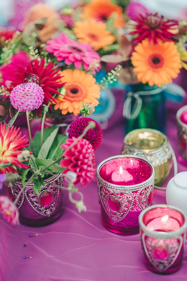 Votives and bright flowers