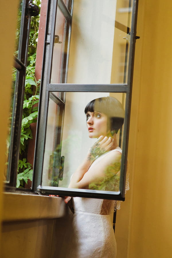 Bride with bob looking out of window