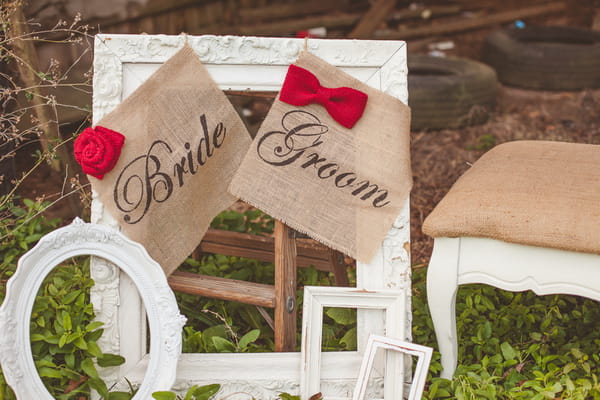 Bride and groom signs on picture frames