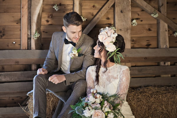 Bride and groom in barn