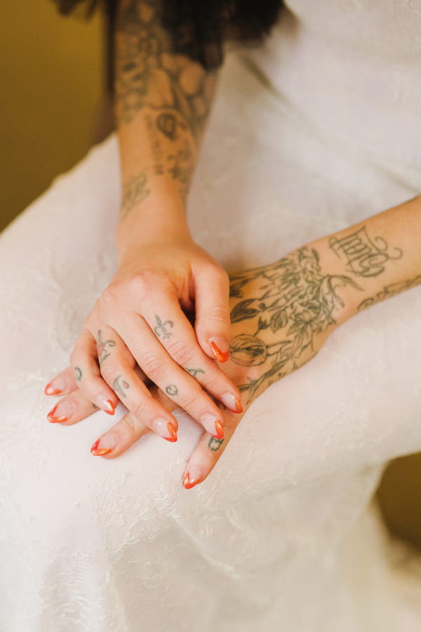 Tattoos on bride's hands