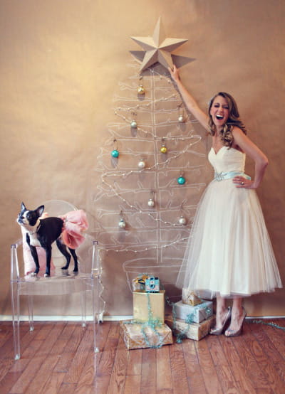 Bride putting star on Christmas tree illustration