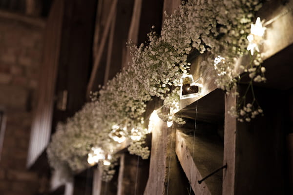 White flowers across barn beam