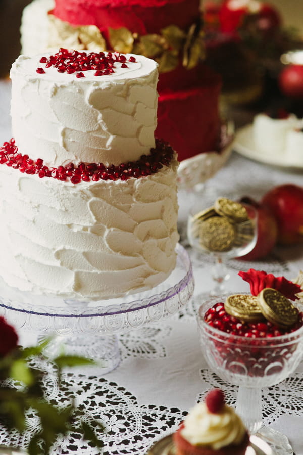 White wedding cake with pomegranate