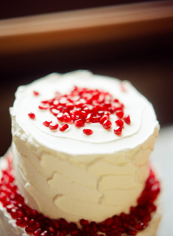 Pomegranate seeds on top of wedding cake