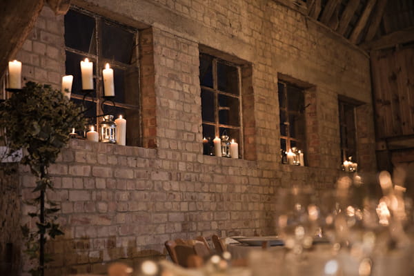 Candles on window ledges in barn