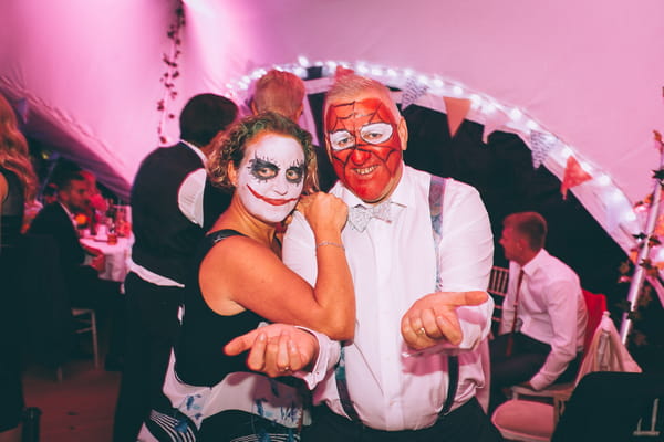 Wedding guests with faces painted
