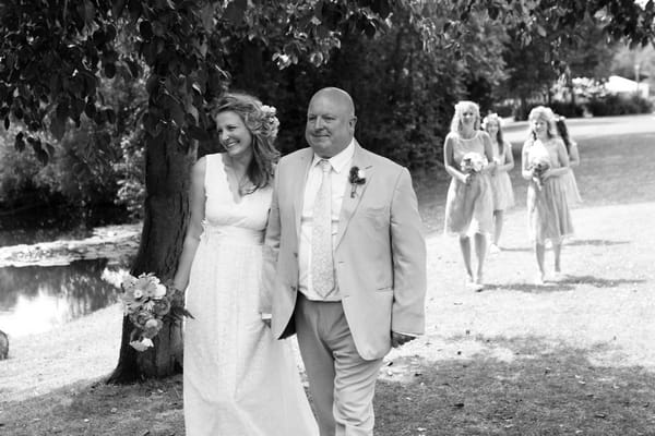 Father walking daughter down the aisle
