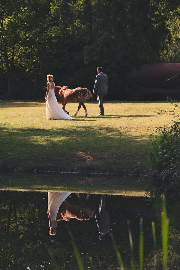 Bride and groom with pony