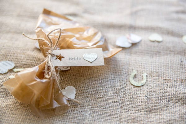 Rustic wedding place setting on hessian tablecloth