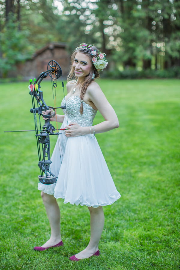 Bride holding bow and arrow