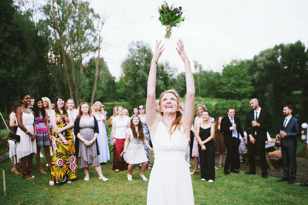 Bride tossing bouquet